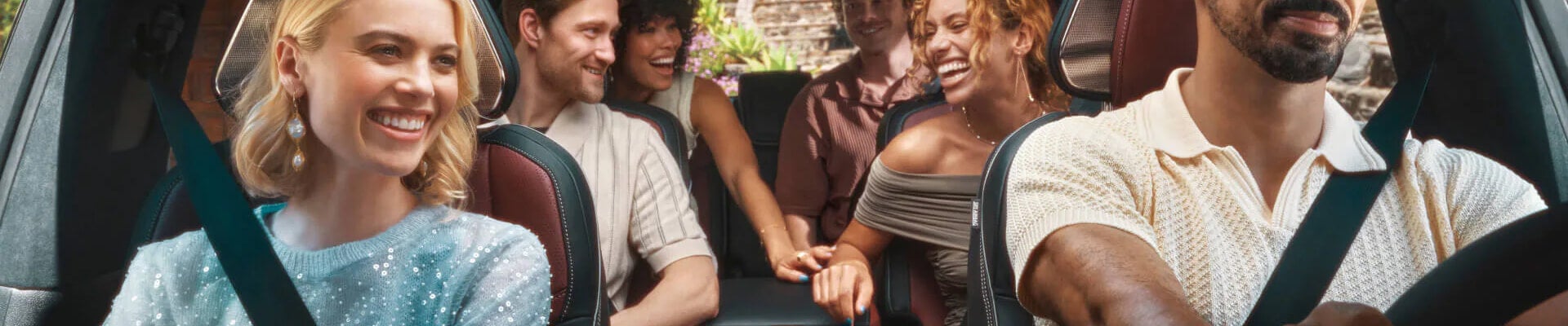 Multiple people riding in the Infiniti QX80