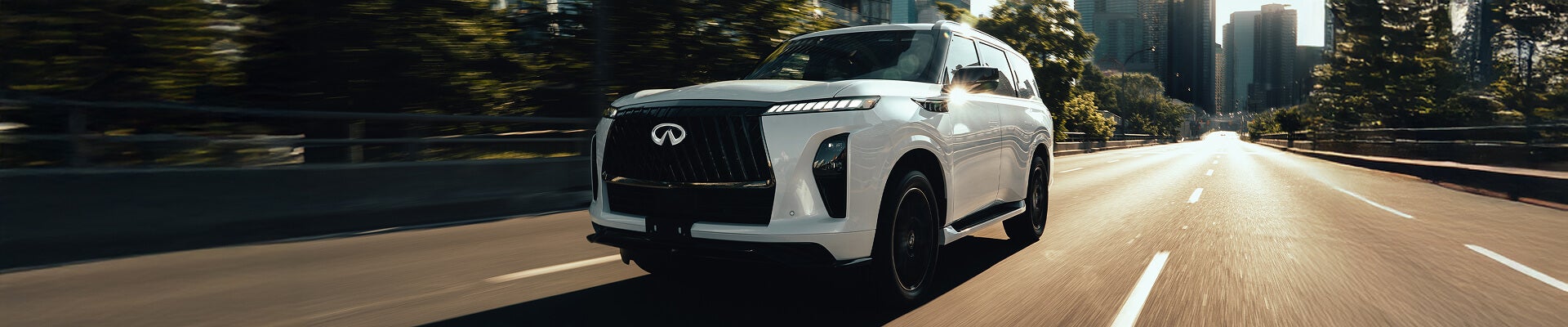 2026 Infiniti QX80 driving on highway