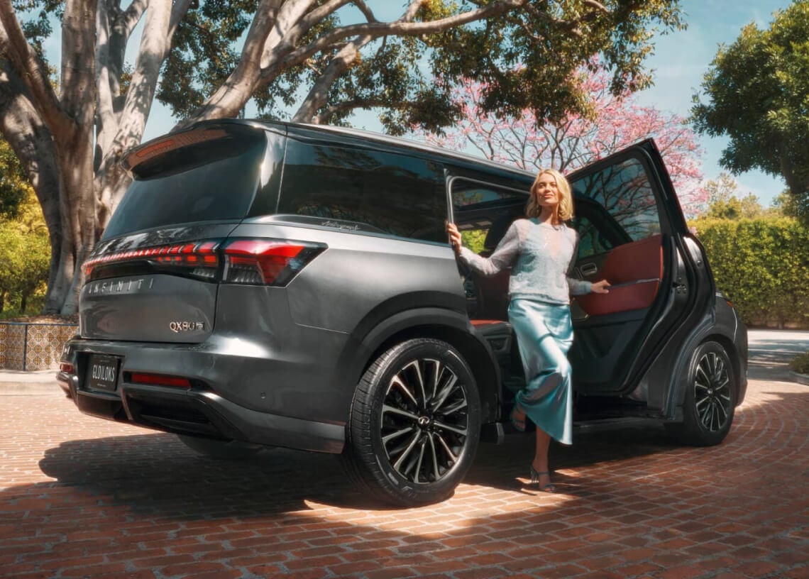 Woman stepping out of the 2026 Infiniti QX80